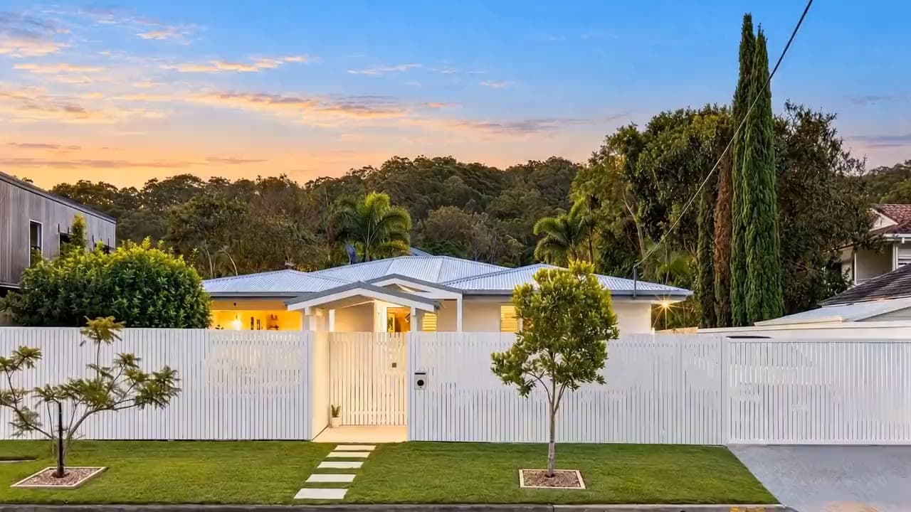 The front of the house at dusk, the first shot of its listing video
